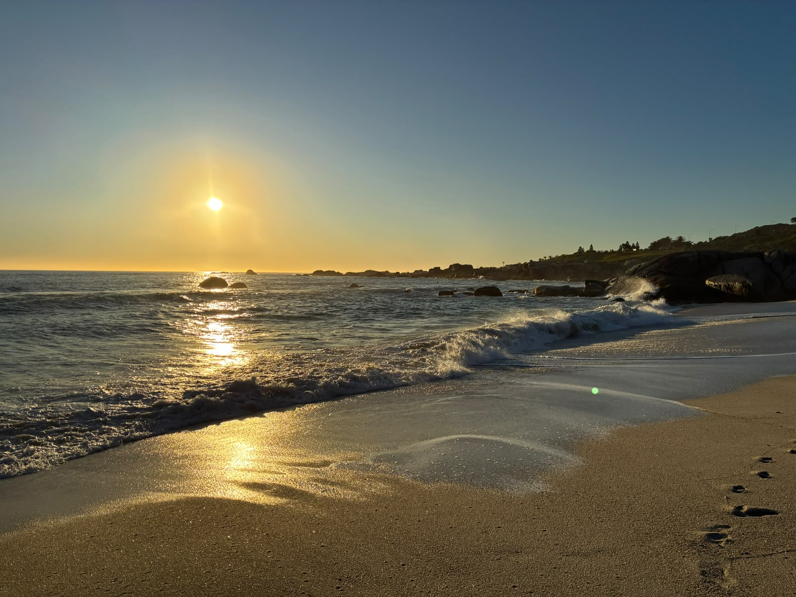 Ocean waves and shoreline during golden sunset